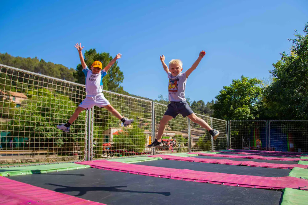 Outdoor fun in Provence: kids enjoying trampolines at an activity park near Gordes