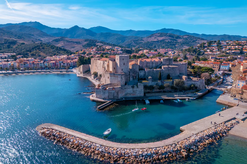 The Château Royal de Collioure reflected in the crystal clear waters of the Mediterranean.