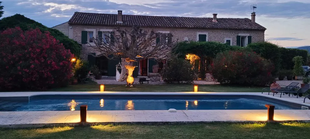 Mas La Pomarede guesthouse at sunset, surrounded by nature and tranquility