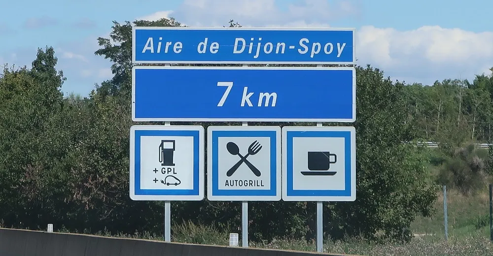 Example of a signage panel indicating the approach to a service area on French highways.