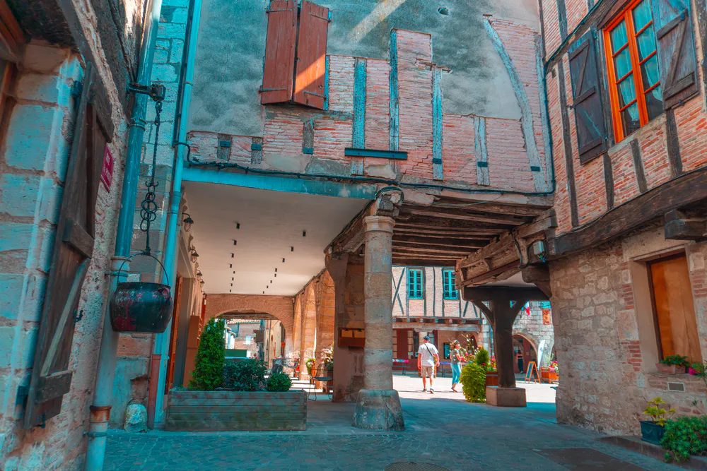 Medieval arched street in Castelnau-de-Montmiral, reflecting the historical charm of the place.